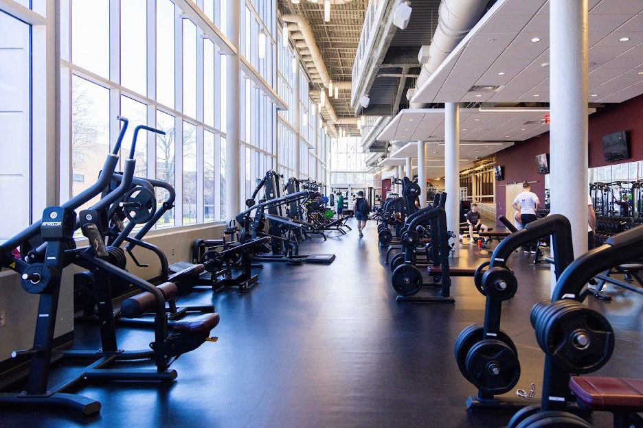 students working out on exercise equipment