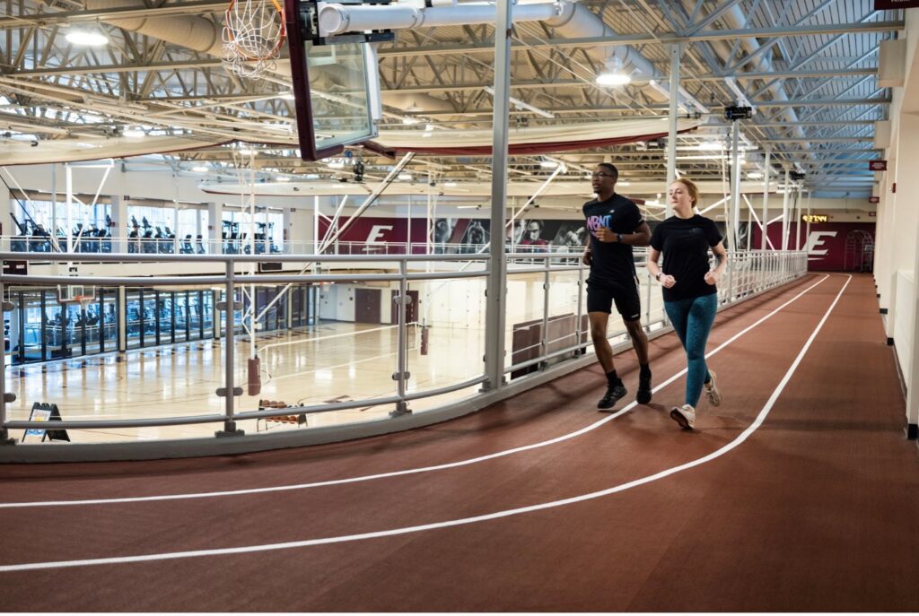 students running on the indoor track