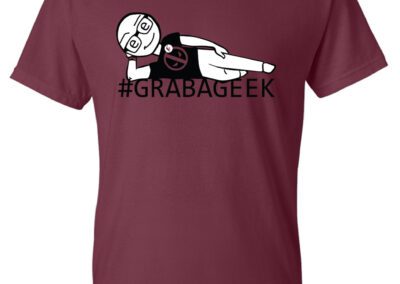a T-shirt with an illustration that says Grab a Geek