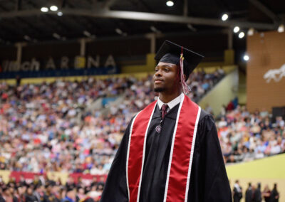 a student smiles during the commencement ceremony