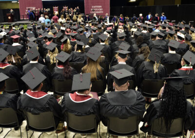 students face the stage during the commencement ceremony