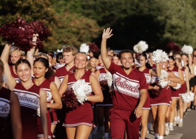 cheerleaders wave during the Big E Welcome Walk