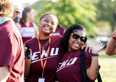 two smiling students pose during the Big E Welcome Walk