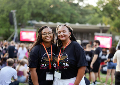 Two female EKU students take a break to pose while waiting for the Flo Rida concert in the ravine to begin