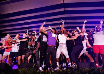 Flo Rida and crew rap and celebrate with EKU students on stage at the out door night time concert