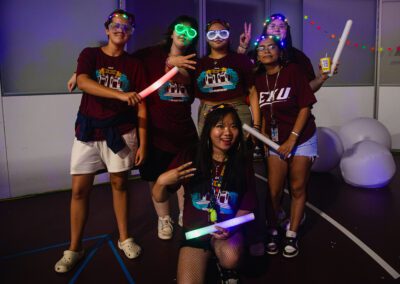 students pose with colored glasses and headbands