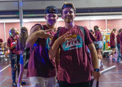 students show off their paint spatters during the Big E Bash