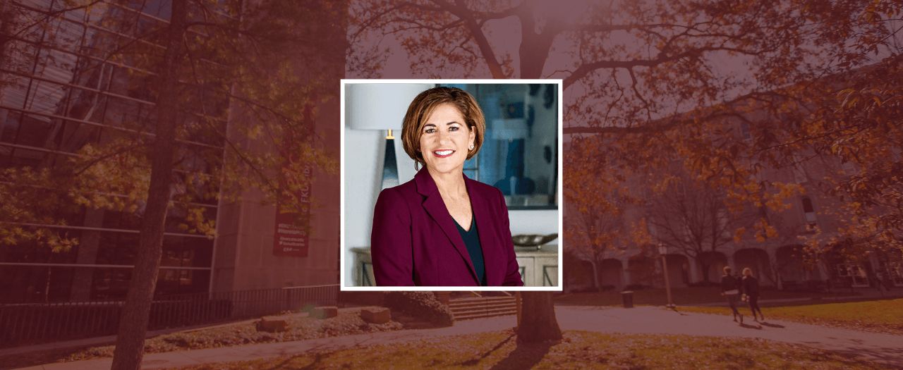 Dressed in a maroon blazer, EKU alumna Maribeth McBride Berman poses for a professional photo.