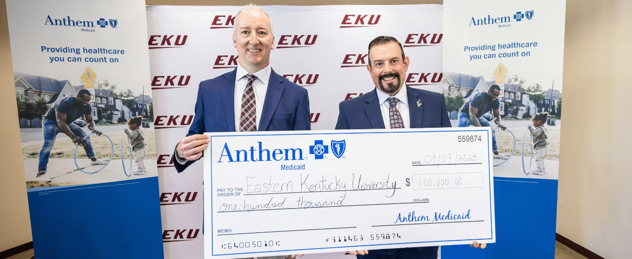 EKU President, David McFadden, receives a check from Anthem Blue Cross and Blue Shield.