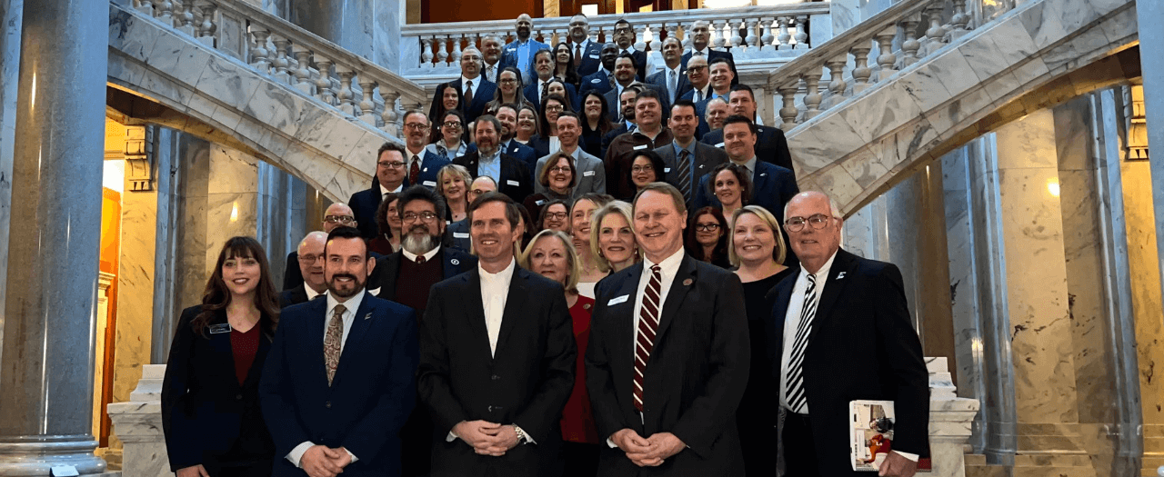 EKU Regents, faculty and staff pose in the Kentucky Capital rotunda with Governor And Beshear.