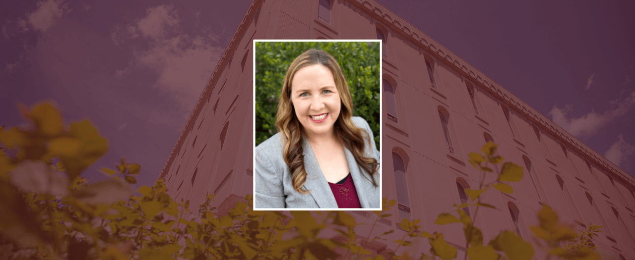 Elizabeth Smith smiles for a professional portrait.