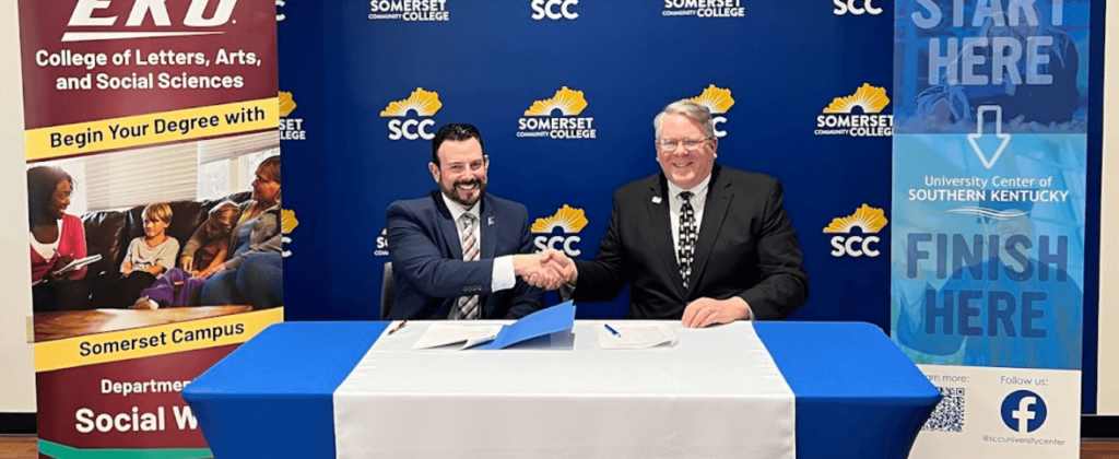 EKU President David McFaddin shakes hands with Somerset Community College President Carey Castle after signing an agreement for collaboration.