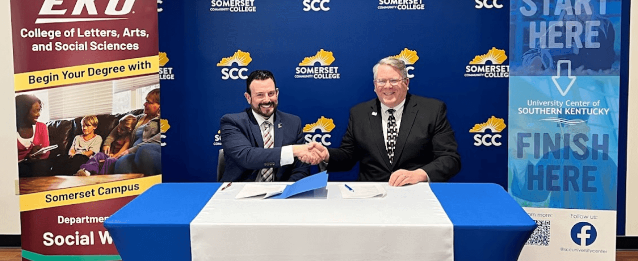 EKU President David McFaddin shakes hands with Somerset Community College President Carey Castle after signing an agreement for collaboration.