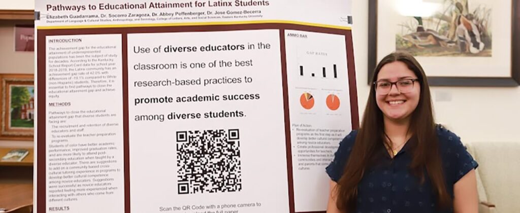 EKU student Elizabeth Guadarrama stands in front of her presentation materials.