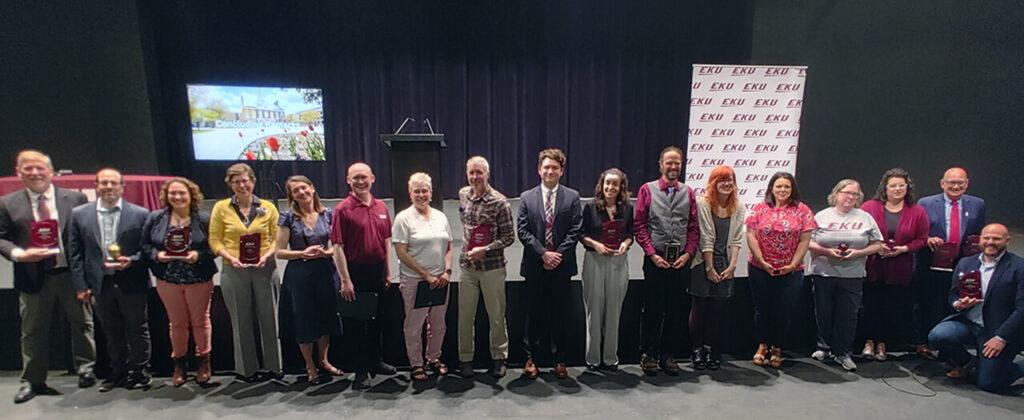 A group of EKU Faculty stand together to display their awards.