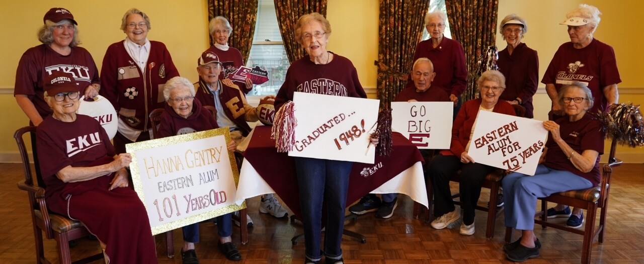 Residents and friends of EKU Alumna Hanna Gentry wear EKU shirts and celebrate her 101st birthday.