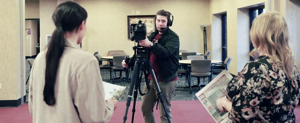 EKU's Joseph Becker filming an interview with EKU students.