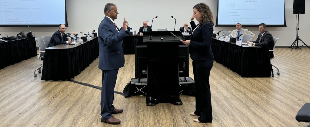 University Counsel's Dana Fohl swears in Vasu Vasudevan to EKU's Board of Regents.