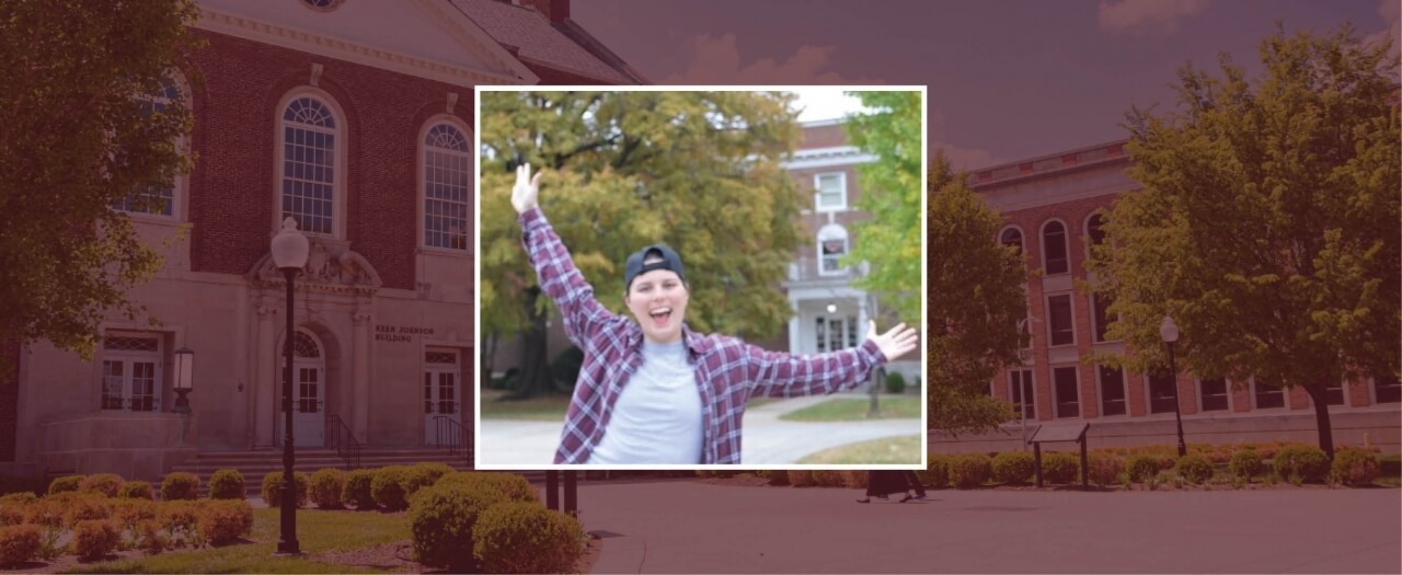 Kandis Jenkins celebrates outside Keen Johnson building on EKU's campus.