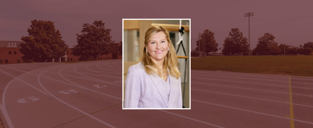 EKU alumna Pam Marshall smiles in a lavender suit.