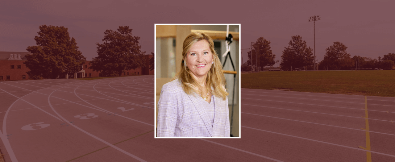 EKU alumna Pam Marshall smiles in a lavender suit.