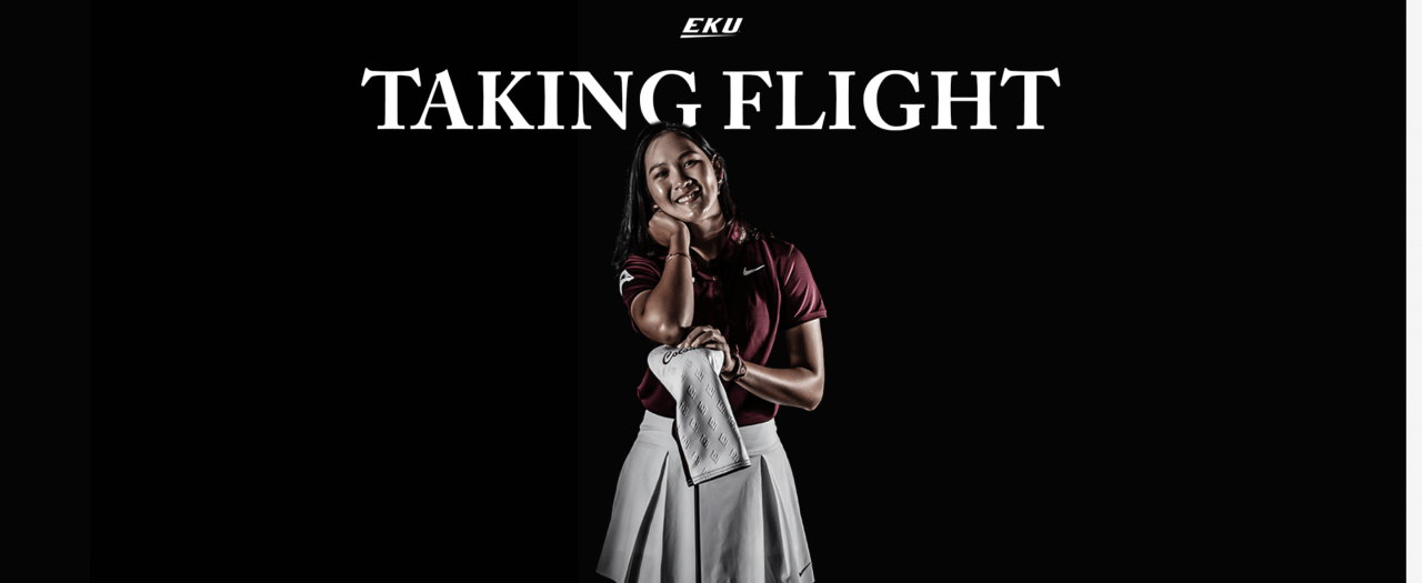 EKU's Dili Sitanonth stands in her golf uniform in front of a black screen