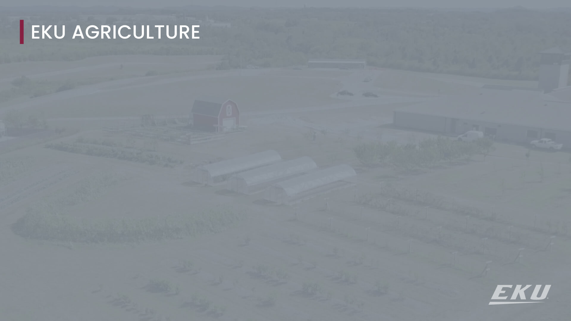 text that says EKU agriculture with a drone image of a farm with a barn, greenhouses and plants