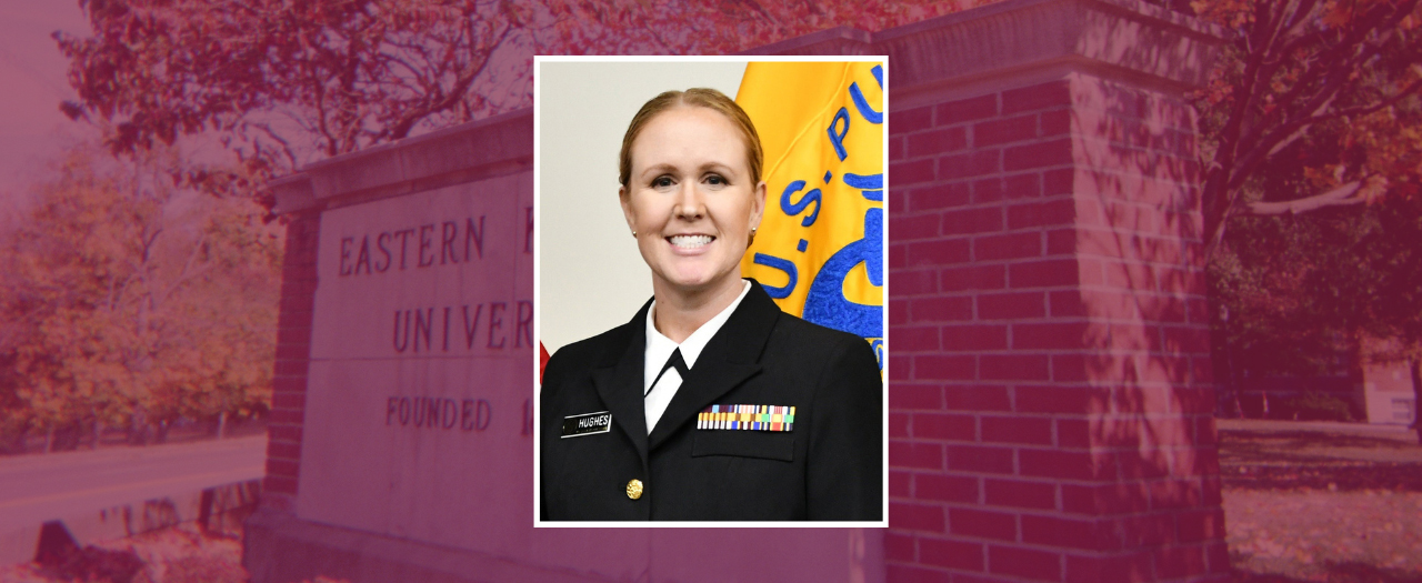 Sarah Hughes, dressed in her uniform, smiles for a photo.